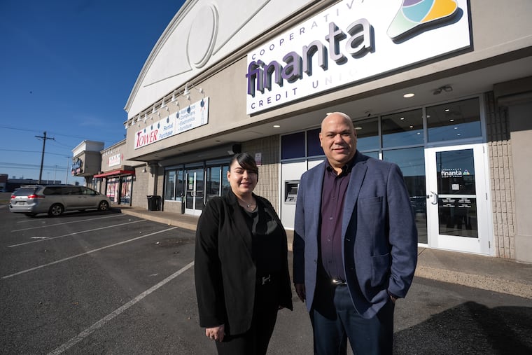 Iris Santiago, branch manager (left) and Daniel Betancourt, president and CEO of Finanta Credit Union, at the credit union's new branch in Port Richmond.