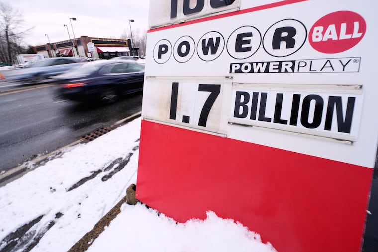 The jackpot for the Powerball lottery game is displayed outside Ted's State Line Mobil station, Wednesday, Dec. 24, 2025, in Methuen, Mass.