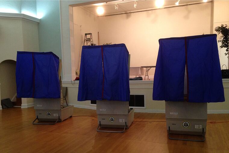 Voting booths await voters this morning at the Greek Orthodox Church on South Eighth Street in Center City.