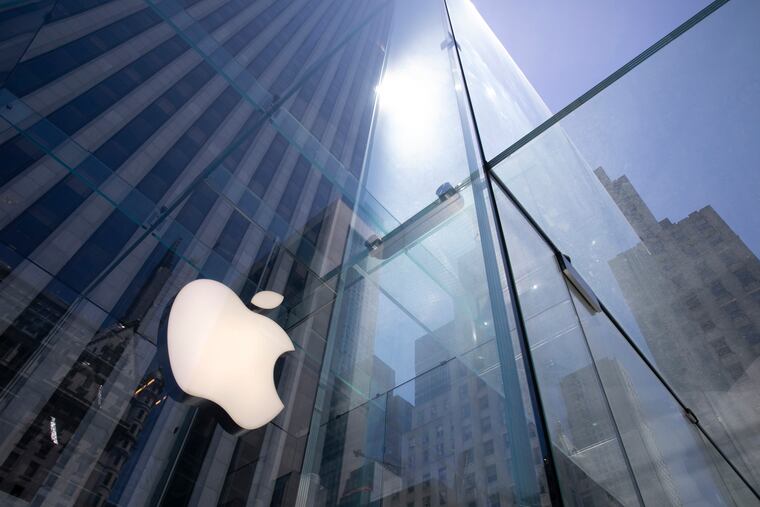 The sun is reflected on Apple's Fifth Avenue store in New York.