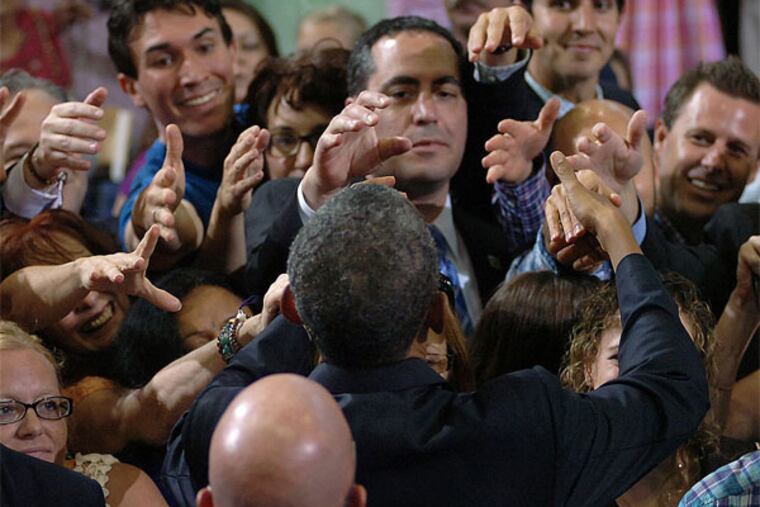 President Obama receives a show of hands to shake after his speech at Lackawanna College. (AP / Scranton Times-Tribune, Butch Comegys)