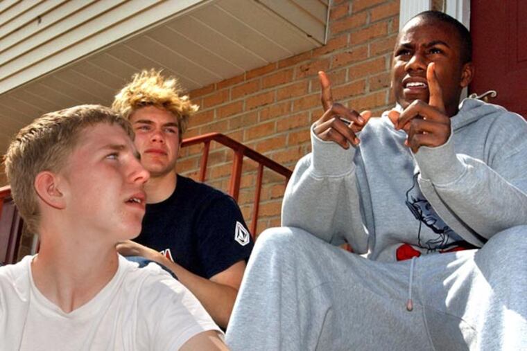 Chris Hill, right, talks about James Sheets as he sits on his front steps on April 25, 2003, in Red Lion, Pa. Hill and his friends Josh Seward, left, and Mike Shultz, center, lived in the same neighborhood and went to school with Sheets, 14, who armed with several handguns, shot and killed the Red Lion Area Junior High School principal before killing himself in a crowded school cafeteria a day earlier. (AP File Photo/Carolyn Kaster)