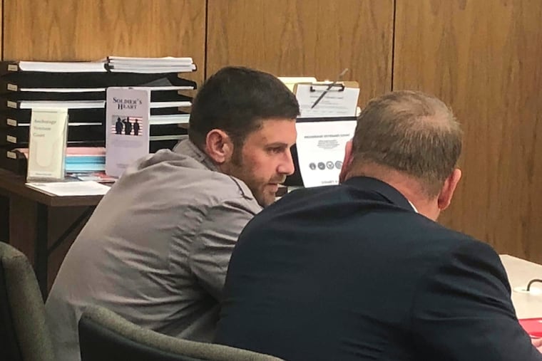 FILE - In this Oct. 3, 2018, file photo, Track Palin, left, talks with his lawyer Patrick Bergt before a hearing in Anchorage, Alaska. The oldest son of former Alaska Gov. Sarah Palin checked in to an Anchorage halfway house Wednesday, Dec. 5, 2018, to begin a year in custody in an assault on his father. Track Palin was initially scheduled to enter the halfway house Oct. 31 after new assault allegations disqualified him from a veterans therapeutic court program. But he won a delay after his lawyer said a bed at a treatment hospital for veterans became available. (AP Photo/Rachel D'Oro, File)