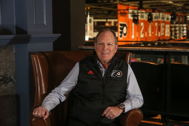Dave Scott, chairman of the Flyers' parent company, Comcast Spectator, sitting in the Wells Fargo Center's new Assembly Room on Tuesday.