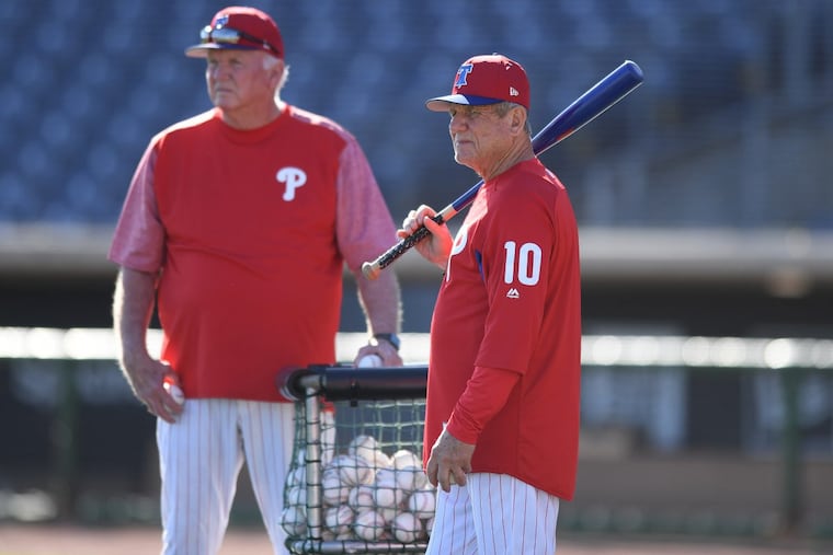 Phillies coaches, Charlie Manuel left, and Larry Bowa direct players, at batting practice during spring training workouts at Spectrum Field, in Clearwater Florida. Friday, Feb. 16, 2018.