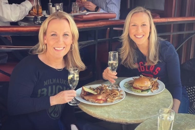 Kate Scott, right, and Lisa Byington have dinner. Their historic hirings as play-by-play announcers for the Sixers and Milwaukee Bucks, respectively, were announced within days of each other last fall.