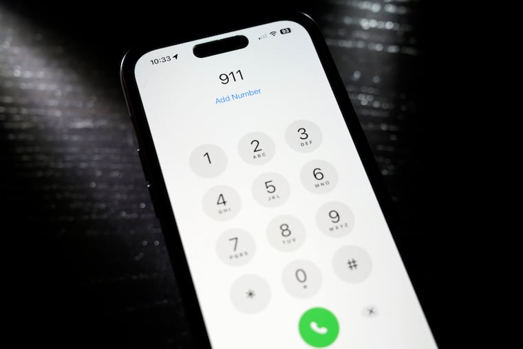 Emergency 911 number is dialed on a mobile phone, Thursday, April 18, 2024, in St. Louis. Law enforcement agencies in Nebraska, Nevada, South Dakota and Texas reported temporary outages to 911 services on Wednesday before saying hours later that services had been restored. (AP Photo/Jeff Roberson)