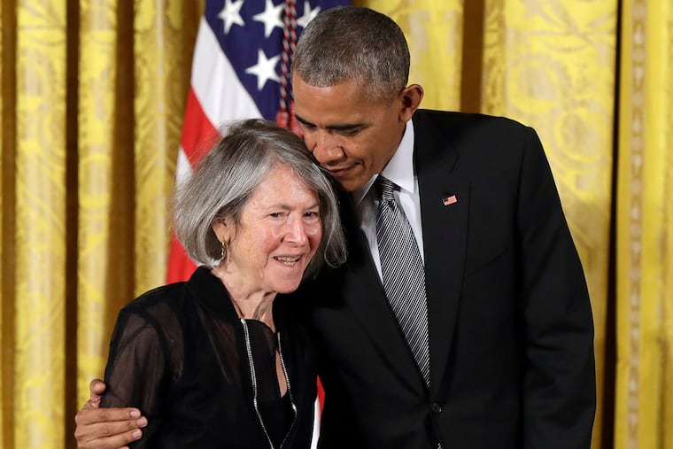 In this Sept. 22, 2016 photo, President Barack Obama embraces poet Louise Gluck before awarding her the 2015 National Humanities Medal during a ceremony in the East Room of the White House.
