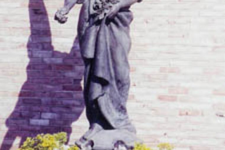 This "Angel of the Roses" statue, originally on display at the Hall of Justice in Sao Paolo, Brazil, was reported stolen from the National Center for Padre Pio in Barto, Berks County. It stands over 6 feet tall.
