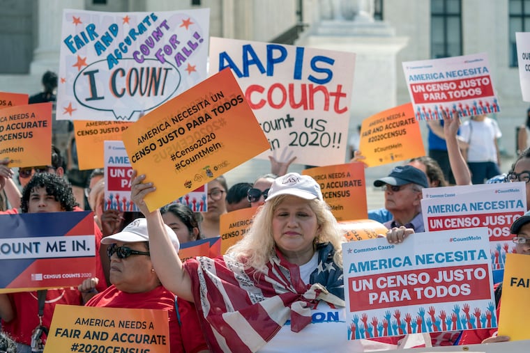Immigration activists rally outside the Supreme Court as the justices hear arguments over the Trump administration's plan to ask about citizenship on the 2020 census, in Washington. The U.S. Census Bureau has spent much of the past year defending itself against allegations that its duties have been overtaken by politics.