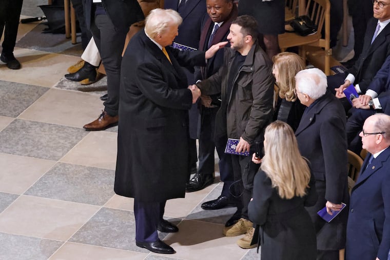 President-elect Donald Trump shakes hands with Ukraine's President Volodymyr Zelenskyy in Notre Dame Cathedral as France's iconic cathedral is formally reopening its doors for the first time since a devastating fire nearly destroyed the 861-year-old landmark in 2019.
