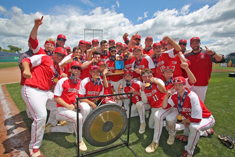 The Souderton baseball team poses with the trophy after winning the PIAA Class 6A championship.