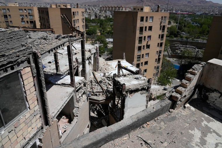 Damage is visible on a residential building that, according to Iranian authorities, was hit by a strike on March 4 during the U.S.-Israeli military campaign, in southeastern Tehran, Iran, Tuesday, April 14, 2026. (AP Photo/Vahid Salemi)