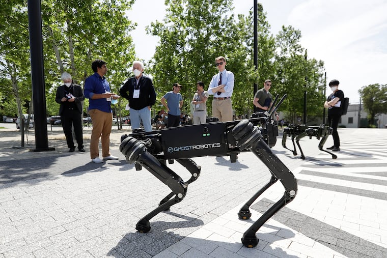 Ghost Robotics Vision 60 robots walk the grounds during the Penn Engineering and Applied Sciences of General Robotics, Automation, Sensing and Perception Lab (GRASP) Technical Tours look at the Pennovation Center during the 2022 IEEE International Conference on Robotics and Automation.