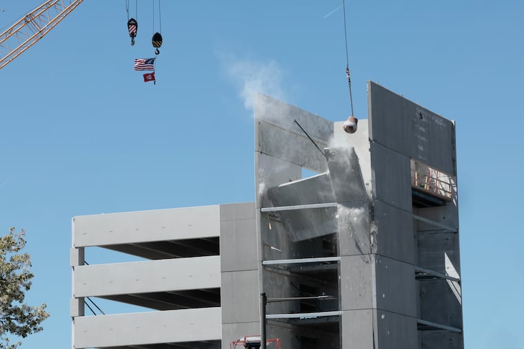 Recovery and demolition operations at the site of the partially collapsed garage in Grays Ferry Saturday, April 11, 2026, in Philadelphia.