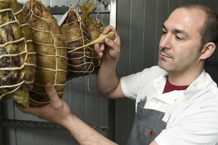 Chef Joe Cicala uses a tool to test the maturation of the meat based on smell. Curing can take as long as 18 months.
