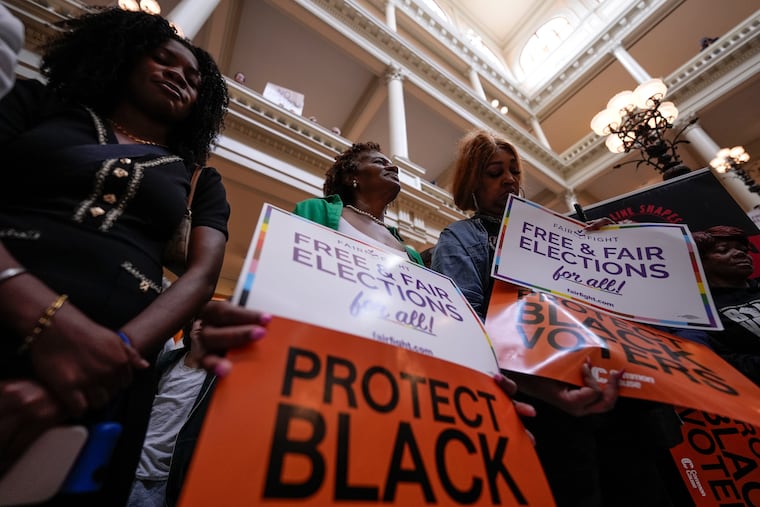 People demonstrate during a special legislative session Wednesday at the state capitol in Atlanta.