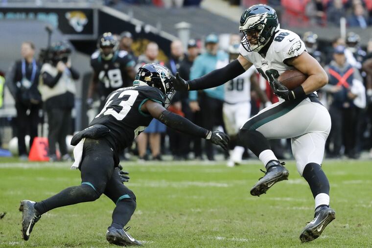 Dallas Goedert shoves off Jacksonville Jaguars defensive back Quenton Meeks late in the second-quarter. Goedert scored on the play.