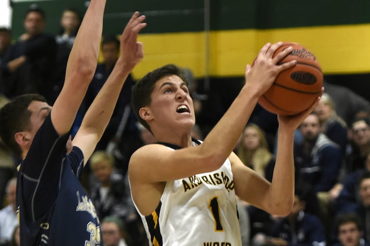 Archbishop Wood's forward Collin Gillespie (right) drives to the basket against La Salle's Ryan McTammney in the first half of play Friday, Jan. 29, 2016.