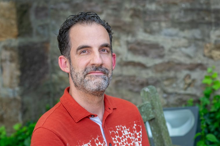 While some teachers have banned AI, Brett Vogelsinger, an English teacher at Central Bucks South High School, asks kids to fill out "transparency surveys" that describe if and how they used the technology while writing. Vogelsinger is pictured outside the Michener Museum in Doylestown.