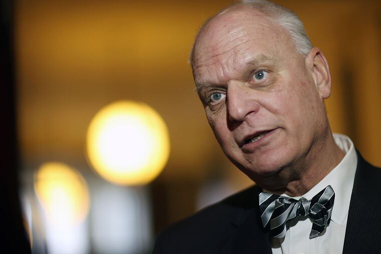Atlantic City Mayor Don Guardian listens to a question as he stands in the Statehouse before Gov. Christie delivers his State of the State address Tuesday. Senate President Steve Sweeney said he will introduce a bill Tuesday to have the state take over Atlantic City's finances.
