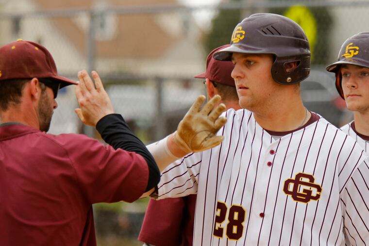 Gloucester Catholic's Luke Lesch is congratulated by coach Adam Tussey after Lech's walk-off RBI single ended the Rams' 10-0 victory over Audubon in the first round of the Diamond Classic.