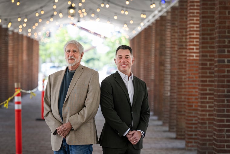 Paul Levy (left) and John Peruto of the New Market and Head House Conservancy pose for a photo at Head House Square in Philadelphia on Friday, May 1, 2026. The conservancy announced a $1.5 million grant to restore the nearly 300-year-old market and headhouse in Society Hill, the first step in what they hope will be a complete restoration of the landmark.