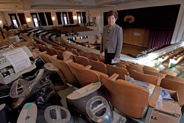 Camden High School on Dec. 11, 2013. Here, Peggy Nicolosi, senior advisor to the Camden Superintendent of Schools, is in the balcony of the school auditorium, which is unusable except for storage. (APRIL SAUL/Staff)