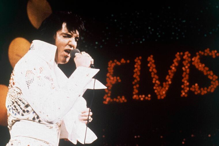 FILE - This 1972 file photo shows Elvis Presley, the King of Rock 'n' Roll, during a performance. Elvis Presley Enterprises says the auction of Elvis Presley-related memorabilia at The Guest House Graceland netted more than $600,000 Tuesday, Jan. 8, 2019. The Guest House is a hotel located steps from the Graceland home, where the singer lived in Memphis. (AP Photo, file)