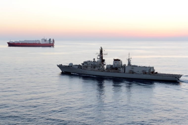 In this image from file video provided by UK Ministry of Defence, British navy vessel HMS Montrose escorts another ship during a mission to remove chemical weapons from Syria at sea off coast of Cyprus in February 2014. (UK Ministry of Defence via AP)