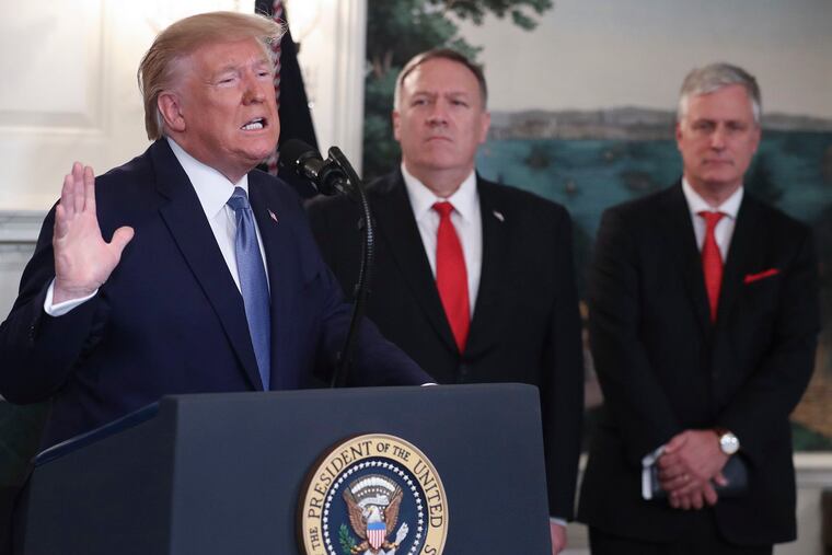President Donald Trump delivers remarks on Syria, next to Secretary of the State Mike Pompeo and National Security Advisor Robert C. O'Brien, right, in the Diplomatic Reception Room of the White House on Wednesday, Oct. 23, 2019 in Washington, D.C.