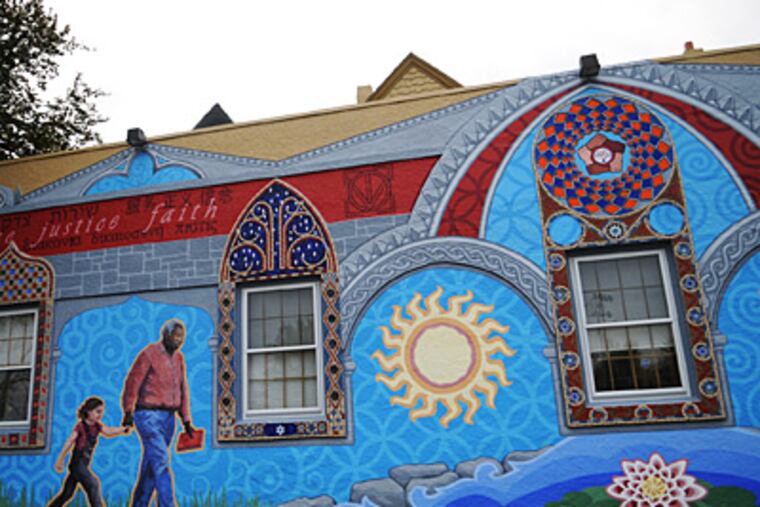 The mural is painted and tiled on the side of the Neighborhood
Interfaith Movement building on Germantown Avenue. (Kriston J. Bethel / Staff)