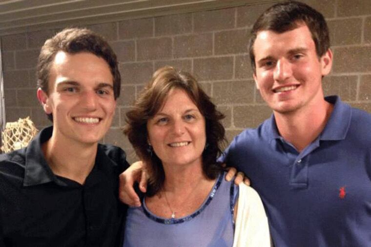 Sean DeLeon, 21 (left) and Michael DeLeon, 18, stand with their mother, Lisa Aiello DeLeon.