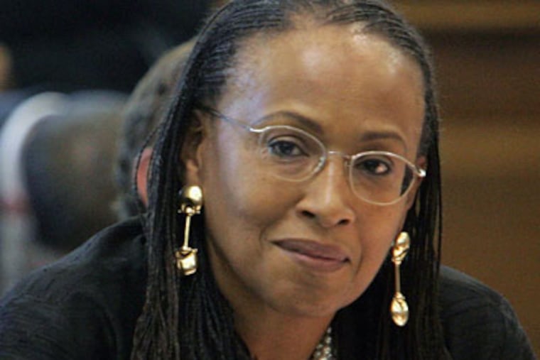 New Jersey Sen. Nina Gill, D-Essex, right, listens as Gov. Jon S. Corzine's nominee for New Jersey Supreme Court chief justice, state Attorney General Stuart Rabner, answers her question as he testifies before the Senate Judiciary Committee in Trenton, N.J., Thursday, June 21, 2007. The hearings were delayed as Gill used her unwritten authority to block nominations for people from her home county. Rabner is from Caldwell in Essex County. Gill never explained why she blocked the nomination, though other senators said she was concerned about Rabner's experience and diversity among state judges. (AP Photo/Mel Evans)