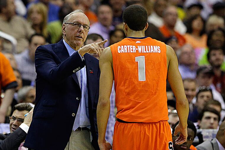 Syracuse head coach Jim Boeheim talks with guard Michael Carter-Williams. (Alex Brandon/AP)