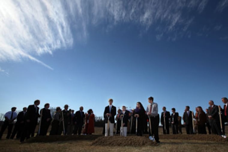 A group of family members and dignitaries prepare to turn their shovels during the ground breaking ceremony for the September 11 Flight 93 National Memorial in Shanksville, Pa. (Laurence Kesterson / Staff Photographer)