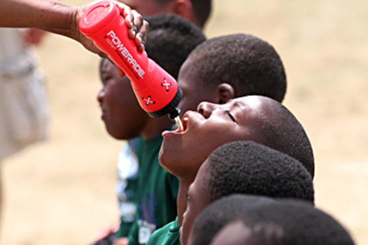These young campers know that this has been a hot summer. Mentor Me is at FDR Park. MICHAEL BRYANT / Staff Photographer