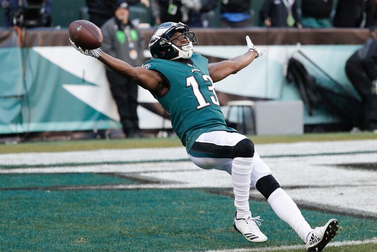 Nelson Agholor falls back into the end zone after scoring on a long touchdown pass from Nick Foles.