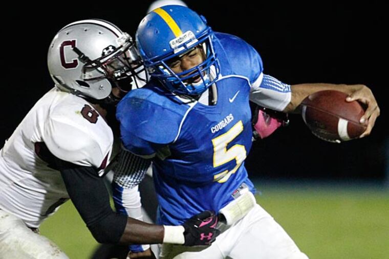 Springfield's Brian Allen is brought down by Conestoga's D'Lydon Coleman. (Ron Cortes/Staff Photographer)