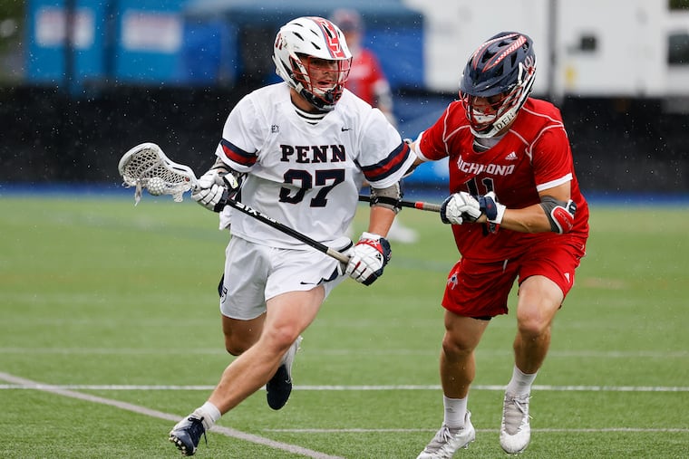 Penn's James Shipley runs with the lacrosse ball against Richmond's Shayne Grant.