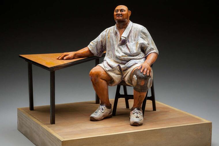 Susan Hagen's "Bruce" is among the carved people - often based on Philadelphians - in her exhibition at the Center for Art in Wood, where she is highlighting the commonality among her pieces.