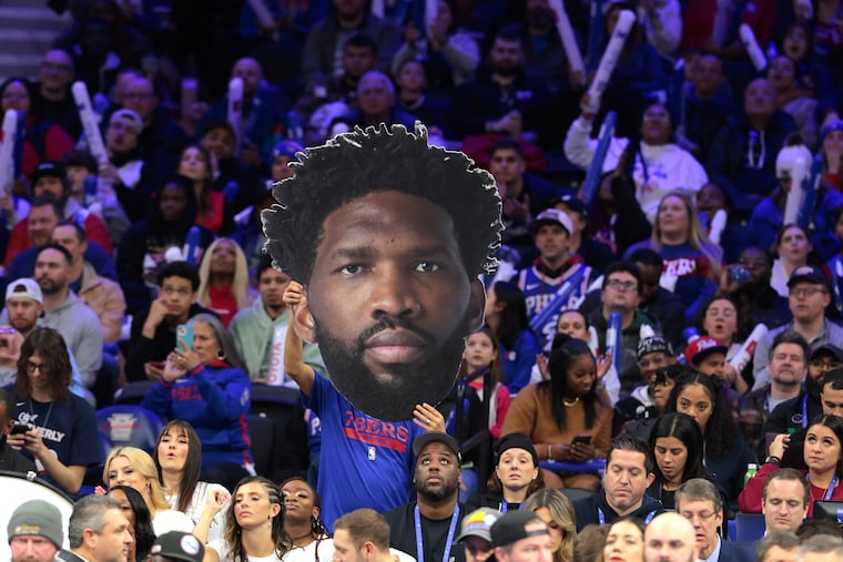 A big head of Joel Embiid of the Sixers held up in the crowd during the game against the Bulls at the Wells Fargo Center on Jan. 2, 2024.