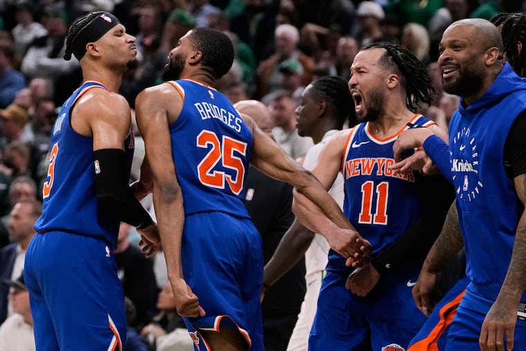 The New York Knicks celebrate after defeating the Boston Celtics in Game 1 of their second-round playoff series.