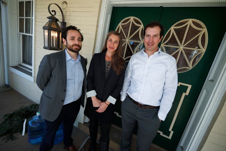In this Thursday, Dec. 20, 2018 photo, from left, attorneys David Seligman, Nina DiSalvo and Alexander Hood of Denver's Towards Justice are shown outside the organization's office east of downtown Denver. A deal filed in federal court in Denver Wednesday, Jan. 9, 2019, will allow young people who have provided low-cost child care for American families to share in a $65.5-million class action settlement with the companies that brought the workers to the United States. (AP Photo/David Zalubowski)