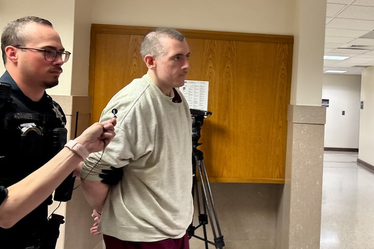 Ryan Selleny is escorted into a courtroom in the Montgomery County courthouse on Monday. Selleny was sentenced to 10 to 60 years in state prison for burglary, indecent assault, and related crimes.