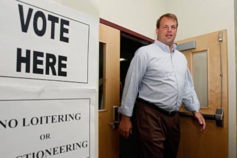 Ex-Eagle Jon Runyan, who won the GOP primary in N.J. for a congressional seat, leaves a Mount Laurel polling place. Runyan will face freshman U.S. Rep. John Adler in November. (MEL EVANS / Associated Press)