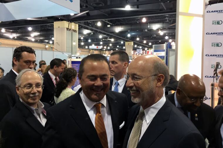 Gov. Wolf (right) with Michael Yang, of Janssen Biotech, at the BIO International 2015 convention. Wolf said Pennsylvania remains a powerhouse in life sciences companies — despite cutbacks in the pharmaceutical industry. (DAVID SELL/Staff)