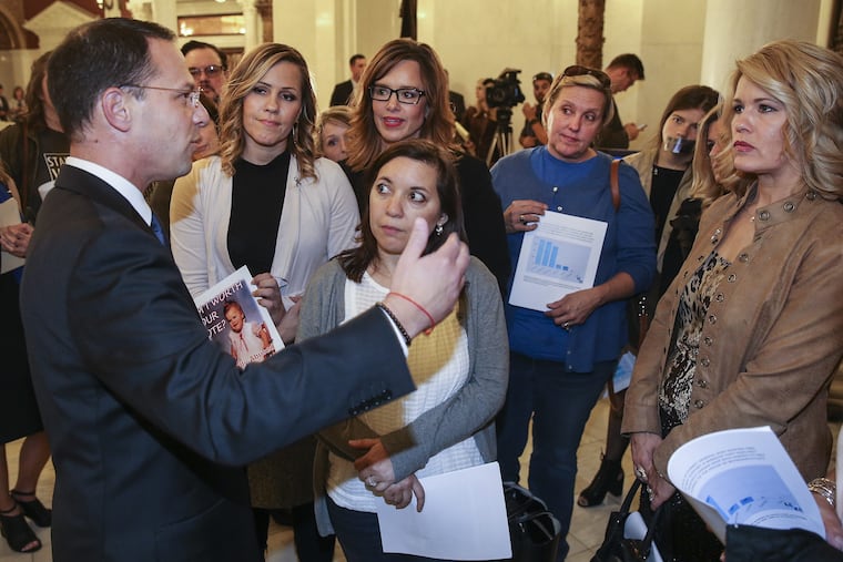 Pennsylvania Attorney General Josh Shapiro speaks to victims of clergy abuse outside the doors of the state Senate on Wednesday.