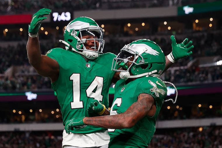 Philadelphia Eagles wide receiver DeVonta Smith (right) celebrates with Philadelphia Eagles running back Kenneth Gainwell (left) after catching a touchdown in the fourth quarter against the Jacksonville Jaguars at Lincoln Financial Field on Sunday, Nov. 3, 2024, in Philadelphia.