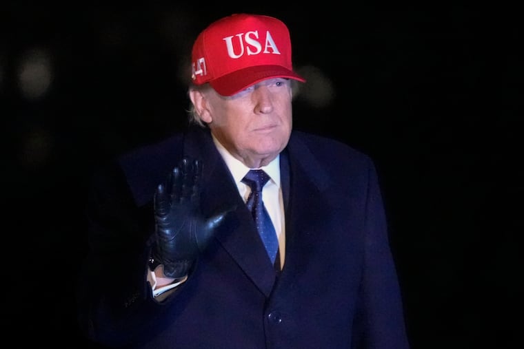 President Donald Trump waves after arriving Sunday on Marine One on the South Lawn of White House.
